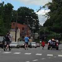 <p>The runners from the Danbury Police Department head down South Street and toward Bethel, where the Special Olympics torch was passed along. </p>