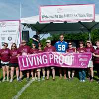 <p>Kathy Giusti with patients living with myeloma and Mark Herzlich.</p>