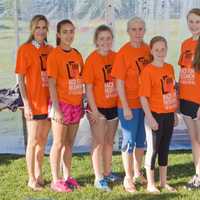 <p>Mothers and daughters from the New Canaan National Charity League serve as volunteers for event registration</p>