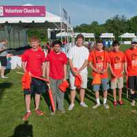 <p>The New Canaan Service League of Boys volunteer their time as course marshals.</p>