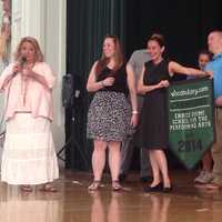 <p>Georgia Scurletis presents Enrico Fermi&#x27;s Stefanie Felidi with the championship banner. </p>