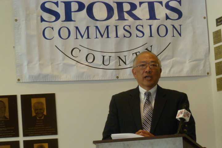 Wah Chu, the father of four-time Olympian Julie Chu, speaks at an announcement Tuesday in Stamford. Julie Chu was one of seven people selected for the Fairfield County Sports Hall of Fame.