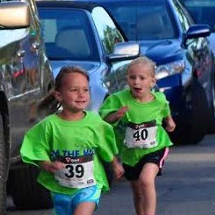 Young runners head for the finish line at the New Canaan Mile.