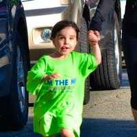 <p>A young runner gets a helping hand in the race.</p>