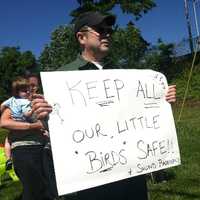 <p>Fairfield residents hold a protest Saturday as they seek to have sound barriers built at the I-95 northbound rest area. Kurt Potter holds a sign saying barriers would help protect the nearby bird sanctuary.</p>