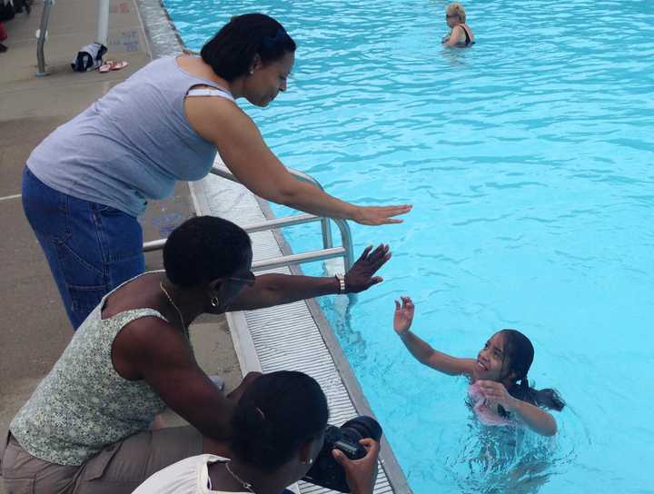 Marisol &quot;Madi&quot; Mallory, of Peekskill, high-fives her mother, Kimmy (left), and grandmother, Patricia Mallory-Smith (center).