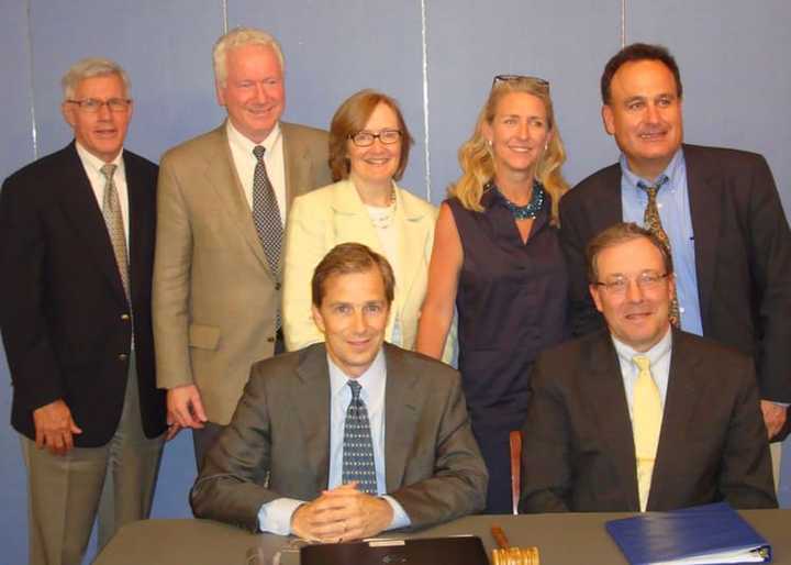 Bronxville Board President David Brashear and Trustee Pierre de Saint Phalle (sitting) with fellow Trustees Jeffrey Rohr, Jim Hudson, Denise Tormey, Ruth Wood and Chris Atayan.