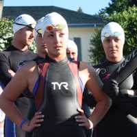 <p>Swimmers listen to pre-event instructions.</p>