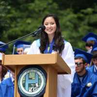 <p>A graduate addresses her class. </p>