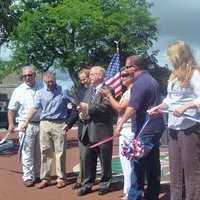 <p>Danbury Mayor Mark Boughton and Director of Public Works Antonio Iadarola lead the ribbon-cutting at the newly redone Kennedy Park. </p>