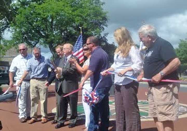 Danbury Mayor Mark Boughton and Director of Public Works Antonio Iadarola lead the ribbon-cutting at the newly redone Kennedy Park. 