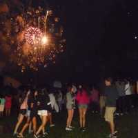 <p>Dozens watched the fireworks display behind White Plains High School Wednesday despite the rain. </p>