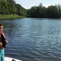 <p>Doug Donaghy, right, and his son Julian spent the afternoon paddle-boarding on Canobus Lake in Fahnstock State Park on Saturday, July 5.</p>