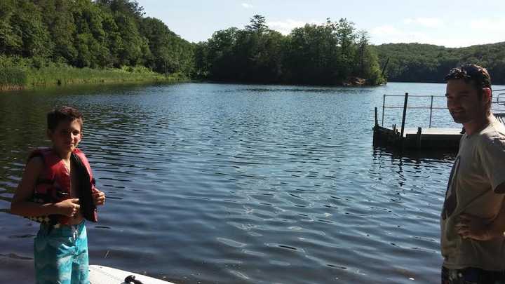 Doug Donaghy, right, and his son Julian spent the afternoon paddle-boarding on Canobus Lake in Fahnstock State Park on Saturday, July 5.