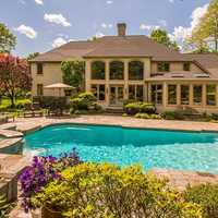 <p>The four bedroom home also has five baths, one half bath and an outdoor pool. </p>