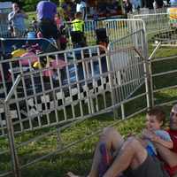 <p>Carmel resident Adam Wallach with his 3-year-old son, Jacob, after coming down a large slide.</p>