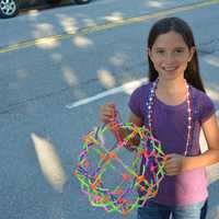 <p>Mount Kisco resident Lilliana Davey, 8 and a half, poses for a photo before the start of the parade.</p>