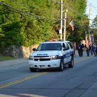 <p>A Mount Kisco police vehicle leads the parade.</p>