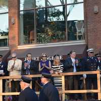 <p>Mount Kisco officials at a stand at the fire department&#x27;s parade.</p>