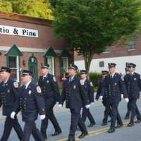 <p>Pleasantville firefighters march in the Mount Kisco parade.</p>