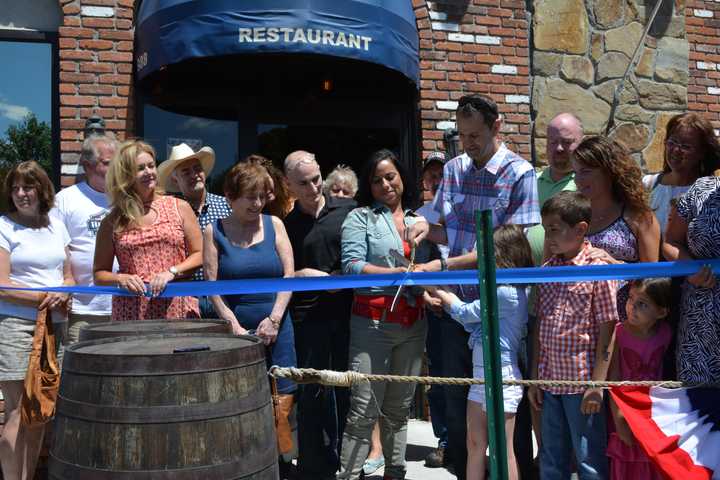 A ribbon cutting, pictured, was held for the grand opening of Bull &amp; Barrel Brew Pub in Southeast.