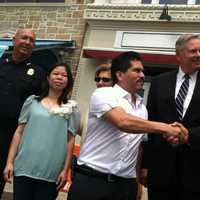 <p>Oscar Moreno, manager of the former Tino&#x27;s nightclub and restaurant, shakes hands with Stamford&#x27;s Public Safety Director Ted Jankowski, while Mayor David Martin looks on. From left are Chief Jonathan Fontneau and Alice Lei, Tino&#x27;s co-owner.</p>