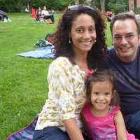 <p>Candace and Adam Caswell and their daughter Ava, 4, watch Shakespeare in the Park. </p>