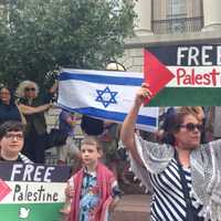 <p>Members of the White Plains social justice organization WESPEC demonstrate at a pro-Israel rally. </p>