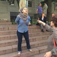 <p>Several residents attending a pro-Israel rally in White Plains Thursday exchanged heated words with a woman protesting Israel. </p>