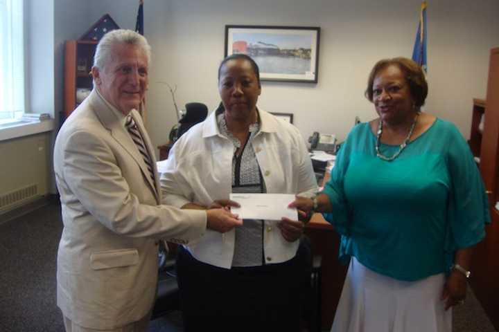 Mayor Harry Rilling, Novelette Peterkin of the Carver Foundation of Norwalk and Juanita James of the Fairfield County Community Foundation.