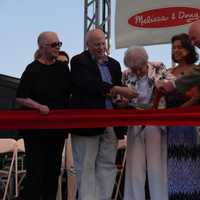 <p>Mimi Levitt, with Westport First Selectman Jim Marpe, former First Selectman Gordon Joseloff and Freda Welsh, cuts the ribbon opening the new pavilion.</p>