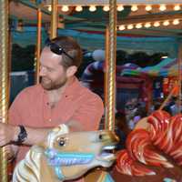 <p>Marc Woodka of Nanuet with his son, 18-month-old Zander, on a carnival ride.</p>