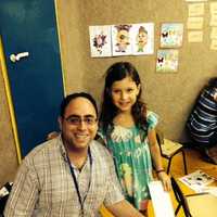 <p>Rabbi Jeremy Wiederhorn with a child from Ashkelon whose summer camp was moved to a bomb shelter.</p>