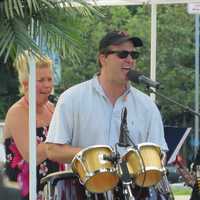 <p>Ken Nichols singing a song from the 1990s as part of the Bronxville Summer Concert Series.</p>