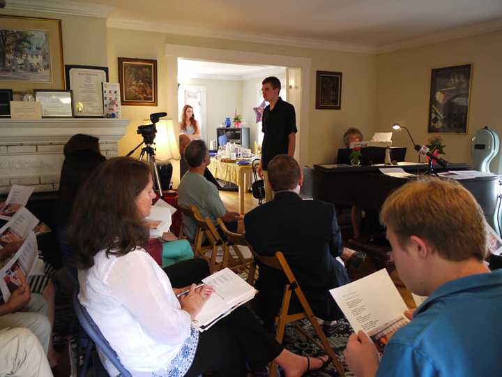 Parents and their adult children with developmental issues gather in a Greenwich home Saturday to discuss the concerns about state aid. 