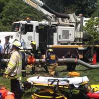 <p>First responders at the scene of a collapsed trench Thursday in Rye. </p>