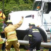 <p>Emergency workers use a City of Rye Vac-truck to clear a collapsed trench that trapped two men. </p>