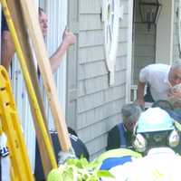 <p>Emergency workers use a City of Rye Vac-truck to clear a collapsed trench that trapped two men. </p>