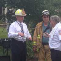 <p>Emergency workers use a City of Rye Vac-truck to clear a collapsed trench that trapped two men. </p>