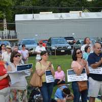 <p>Folks listen to speakers at a rally in Ossining.</p>