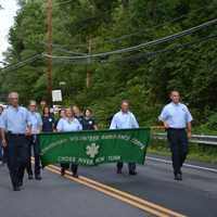 <p>Lewisboro Volunteer Ambulance Corps members march in the South Salem parade.</p>