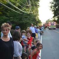 <p>Spectators line the road at the South Salem parade.</p>