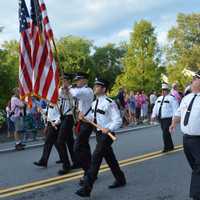 <p>A color guard leads marchers in the South Salem Fire Department  parade.</p>