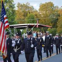 <p>New Canaan, Conn., firefighters march in the South Salem parade.</p>