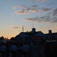 <p>The sun sets above the South Salem firehouse. A Ferris wheel can be seen to the left.</p>