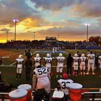 <p>The setting sun makes for a beautiful backdrop at the Section 1 football championships at Mahopac High School in November 2013.</p>