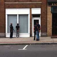 <p>Men are in handcuffs near  Famous Pizza in South Norwalk after a shooting was reported Wednesday afternoon.</p>