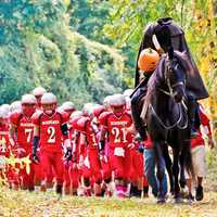 <p>The Sleepy Hollow football team and its legendary mascot take the field for their annual showdown against rival Ossining this past fall.</p>