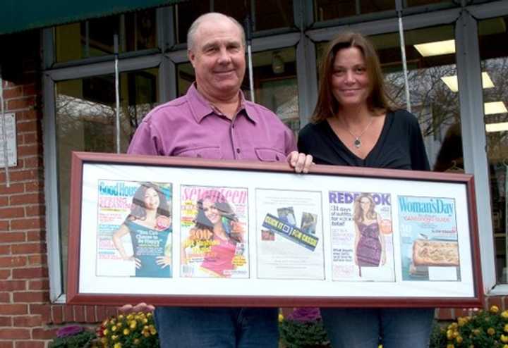 Tom and Anne Geary hold a display of magazine covers with the Click It For Cassie advertisement that appeared across the nation in 2011. 