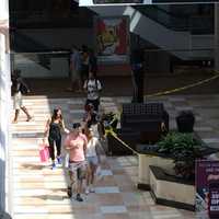 <p>Shoppers stopped and starred at the tapped off area in front of Tourneau, a jewelry stored that was robbed Sunday. </p>